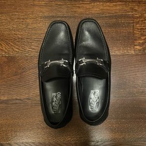 Salvatore Ferragamo black leather drivers with silver Gancini ornament.
